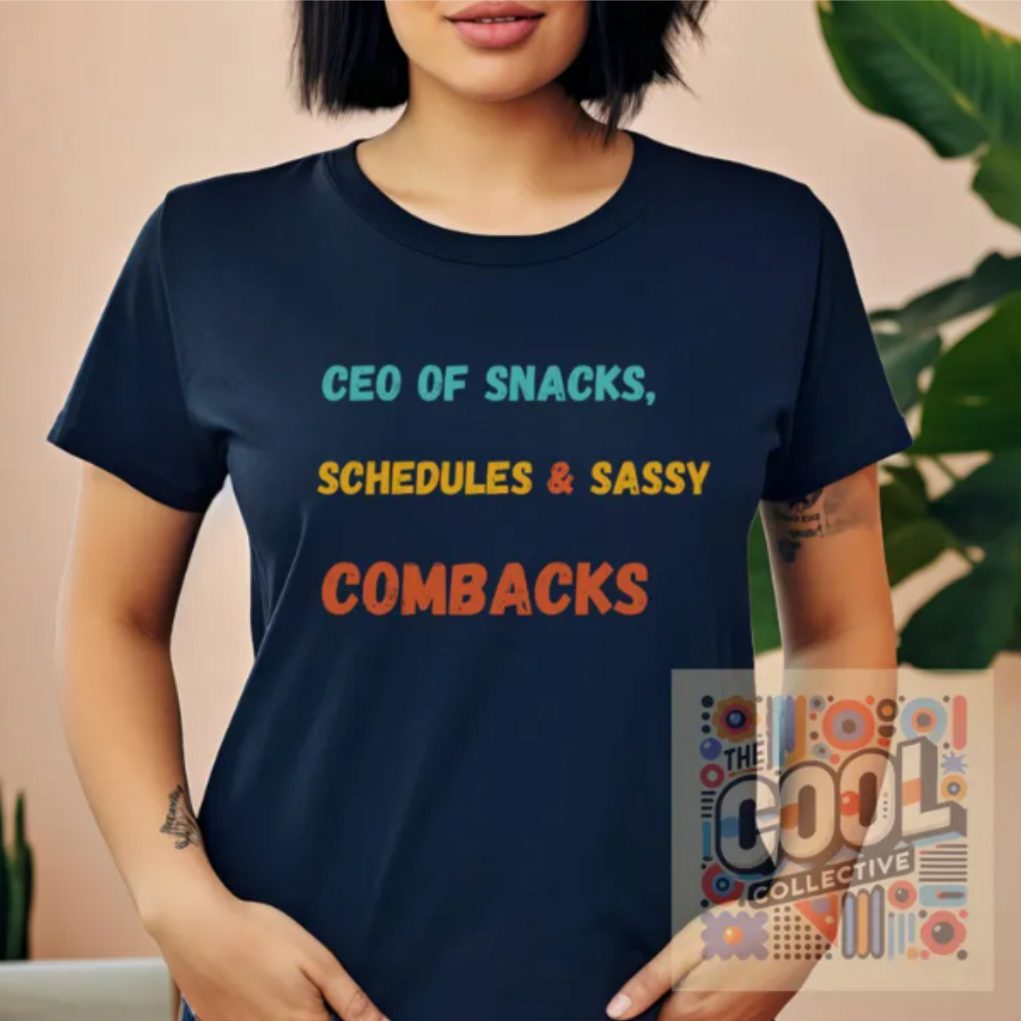 Retro-style T-shirt with the slogan "CEO of snacks, schedules & sassy comebacks" in bold, playful typography, perfect for busy and confident women.